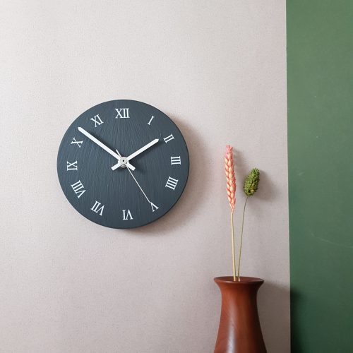 150mm Clock with Roman Numerals on wall by Inigo Jones Slate Works