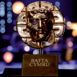 BAFTA Cymru Award. Made of two segments; An engraved Blue Grey Welsh Slate Base with a sloped edge and the famous Metal BAFTA Cymru face attached.