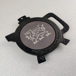 Welsh Heather Blue Round Slate and Black Iron Teapot Stand, with Laser engraved image of a Welsh Dragon, By Inigo Jones Slate Works.